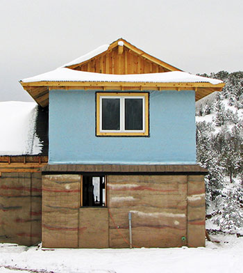 unplastered rammed earth walls